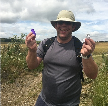 Scott showing one of the geocaches he found. This one was hidden inside a hollowed out branch!
